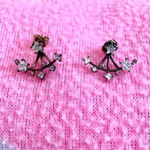 Rose gold colored earrings with stars